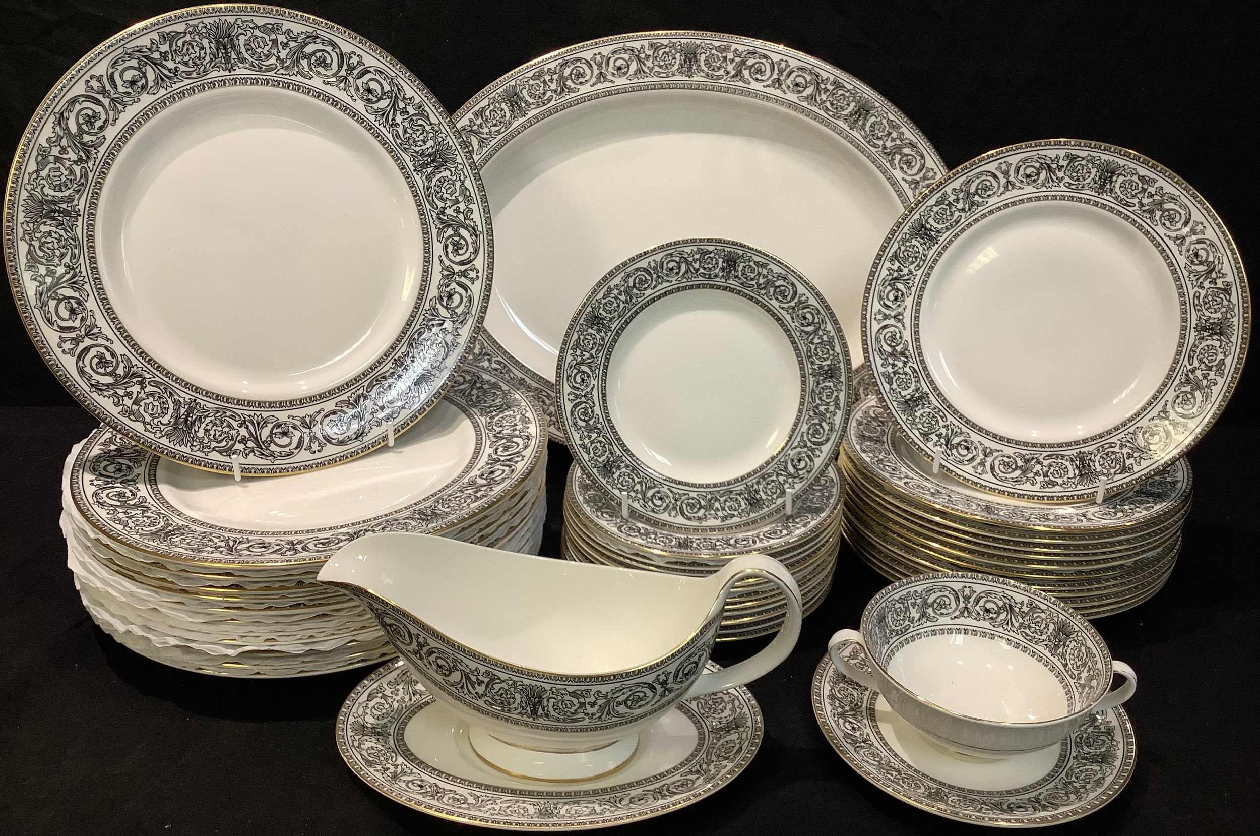 A Royal Doulton Baronet pattern dinner service for twelve comprising dinner plates, dessert