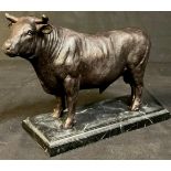 A bronzed metal sculpture of a bull, rectangular stepped marble base, 16.5cm high