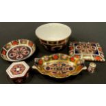 A Royal Crown Derby Imari 1128 pattern sugar bowl, shaped oval pin tray and circular trinket tray,