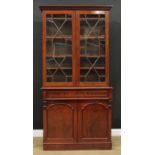 A Victorian mahogany library bookcase, outswept cornice above a pair of astragal glazed doors