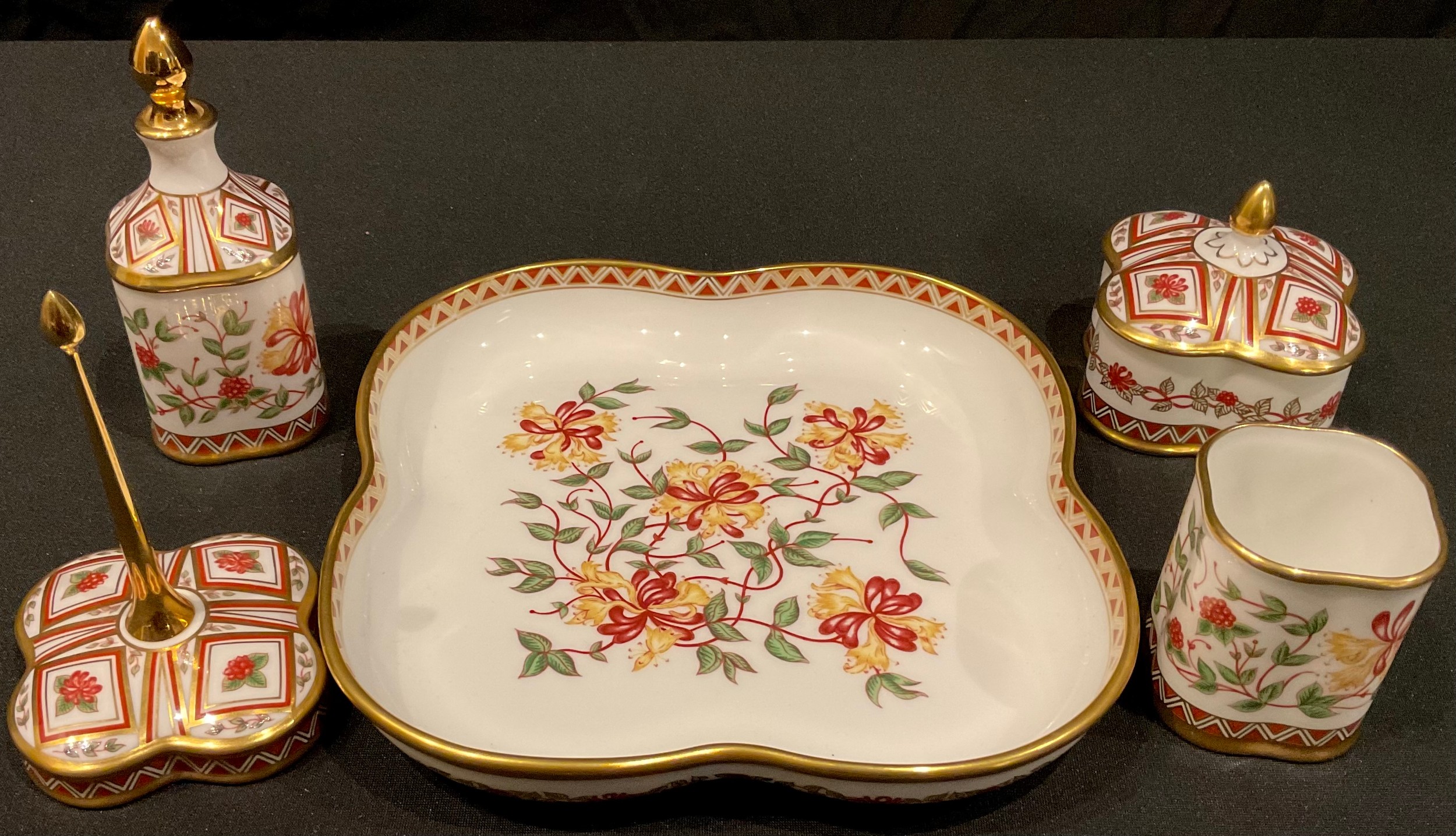 A Royal Crown Derby Honeysuckle pattern dressing table set, comprising scent bottle, trinket pot and