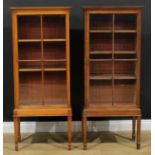 A matched pair of mahogany pier bookcases or display cabinets, 131.5cm high, 56cm wide, 32cm deep (