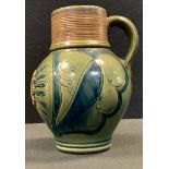 A Wedgwood ale mug, in the style of Westerwald, VA crest, incised, in tones of blue, 15.7cm high,