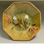 In the style of Dan Arbied (1928-2010) an octagonal studio pottery table bowl, painted with stylized