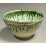 A Dame Lucie Rie style studio pottery bowl, dripped in green on a light jade ground, 7cm deep,
