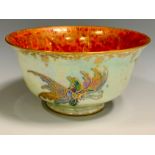 A Wedgwood Fairyland lustre flared circular bowl, the interior with butterfly on a mottled orange
