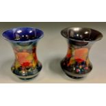 A pair of Moorcroft Pomegranate pattern flared cylindrical vases, tube lined with fruit, blue