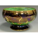 A Wedgwood Fairyland Lustre Leapfrogging Elves pattern compressed ovoid pedestal bowl, designed by