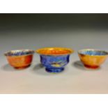 A Wedgwood Fairyland Lustre bowl, flared rim, the interior glazed in mottled orange, applied with