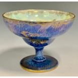 A Wedgwood Dragon lustre pedestal bowl, ogee shaped bowl, designed by Daisy Makeig-Jones, printed in