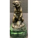 A bronze sculpture of a bear, green marble base, 17cm high