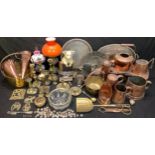 Metalware - brass and copper ware including a brass jam pan, copper measures, brass candlesticks,