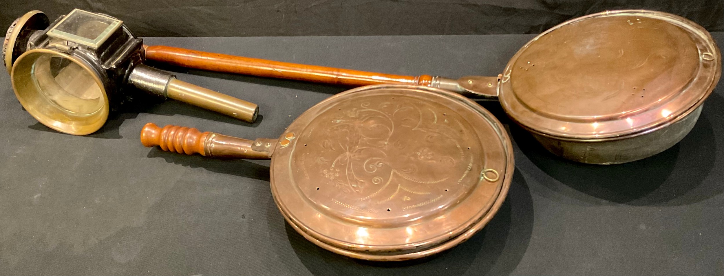 A Victorian copper warming pan; another with short replacement handle; a coach lamp, W Kinross &