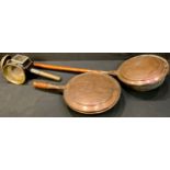 A Victorian copper warming pan; another with short replacement handle; a coach lamp, W Kinross &