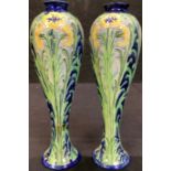 A pair of James Macintyre Florian Ware slender elongated inverted baluster vases, tube lined with