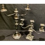 A silver plated two branch candelabrum, 52cm high; another, three branch (2)
