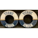 A pair of novelty reproduction Titanic London carved wooden life rings, 48cm