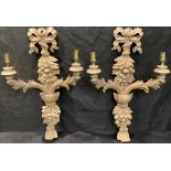 A pair of Louis XIV style carved softwood two-branch wall sconces, 47cm high