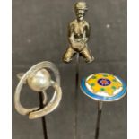A silver Charles Horner hatpin; a silver and enamel hatpin; another