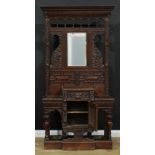 A late Victorian oak hall stand, carved throughout in the 17th century taste, bevelled rectangular