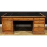 A substantial oak partners' desk, rectangular top with moulded edge above three frieze drawers,