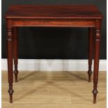 A 19th century mahogany lamp table, rounded rectangular top, tapered octagonal legs, bun-capped