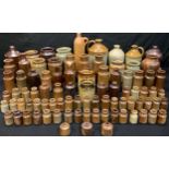 A quantity of Victorian and Edwardian dump dug salt glazed bottles, including flagons, ink