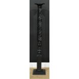 An ebonised hardwood torchère or statuary pedestal, circular top, spirally-reeded column