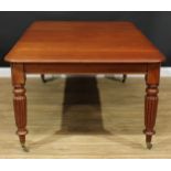 A 19th century mahogany extending dining table, rounded rectangular top with one additional leaf,