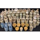 A quantity of Victorian and Edwardian cream glazed stoneware bottles, all dump dug, including
