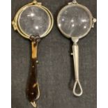 A 19th century tortoiseshell and gilt metal lorgnette; another, Continental silver, marked 835 (2)