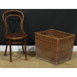 A wicker linen or log bin, 49.5cm high, 59.5cm wide, 48.5cm deep; a bentwood bistro chair, 89cm