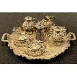 A silver filigree miniature tea service