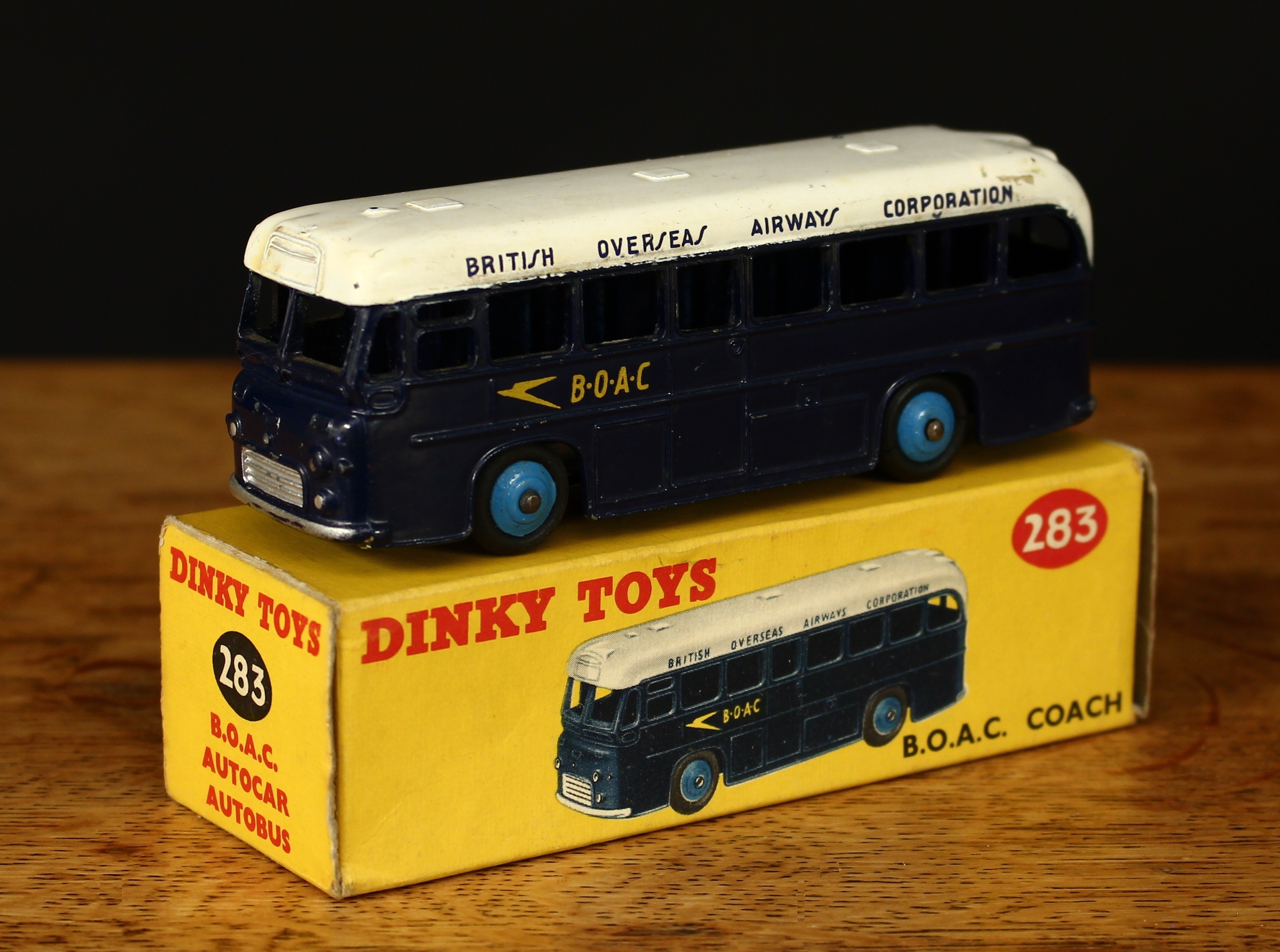 Dinky Toys 283 B.O.A.C. coach, dark blue body with decals, white roof, blue ridged hubs, boxed -