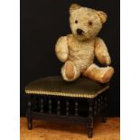 A 1930's/1940's golden mohair jointed teddy bear, amber and black glass eyes, pronounced snout