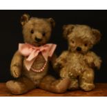 A 1930's Chad Valley novelty golden mohair jointed teddy bear, amber and black glass eyes,