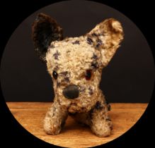 A 1930's Merrythought 'Booboo' type novelty seated dog, mottled black and cream, amber and black