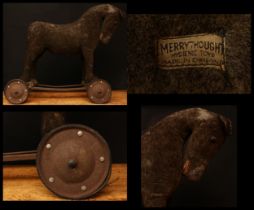 A 1930's Merrythought brown mohair Horse on wheels, straw filled body and head, large amber and