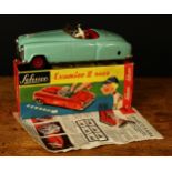 A Schuco (Germany) tinplate and clockwork Examico II 4004 car, sea green body with red interior,