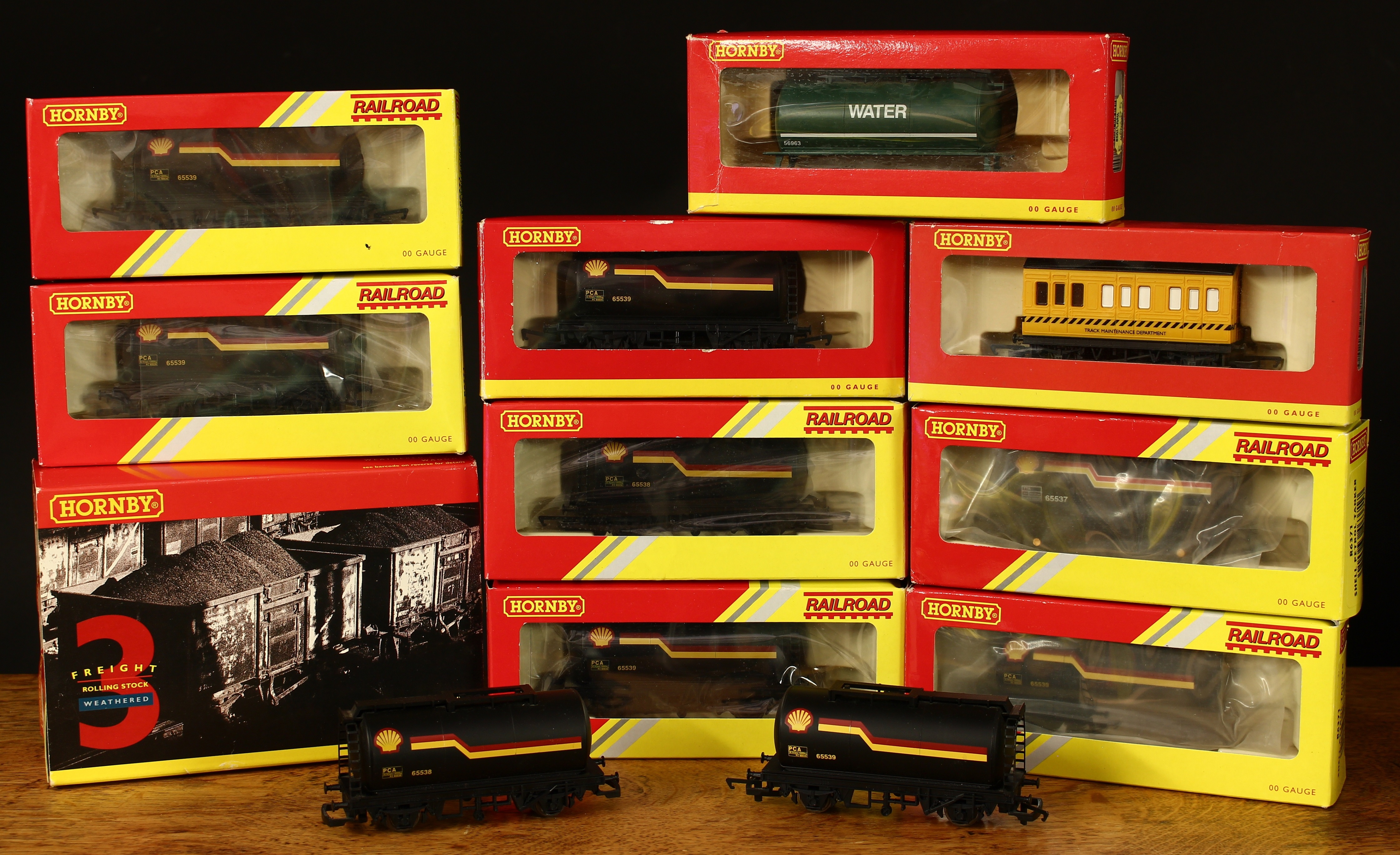 Hornby OO Gauge boxed and unboxed wagons and rolling stock, comprising R296 track cleaning car,