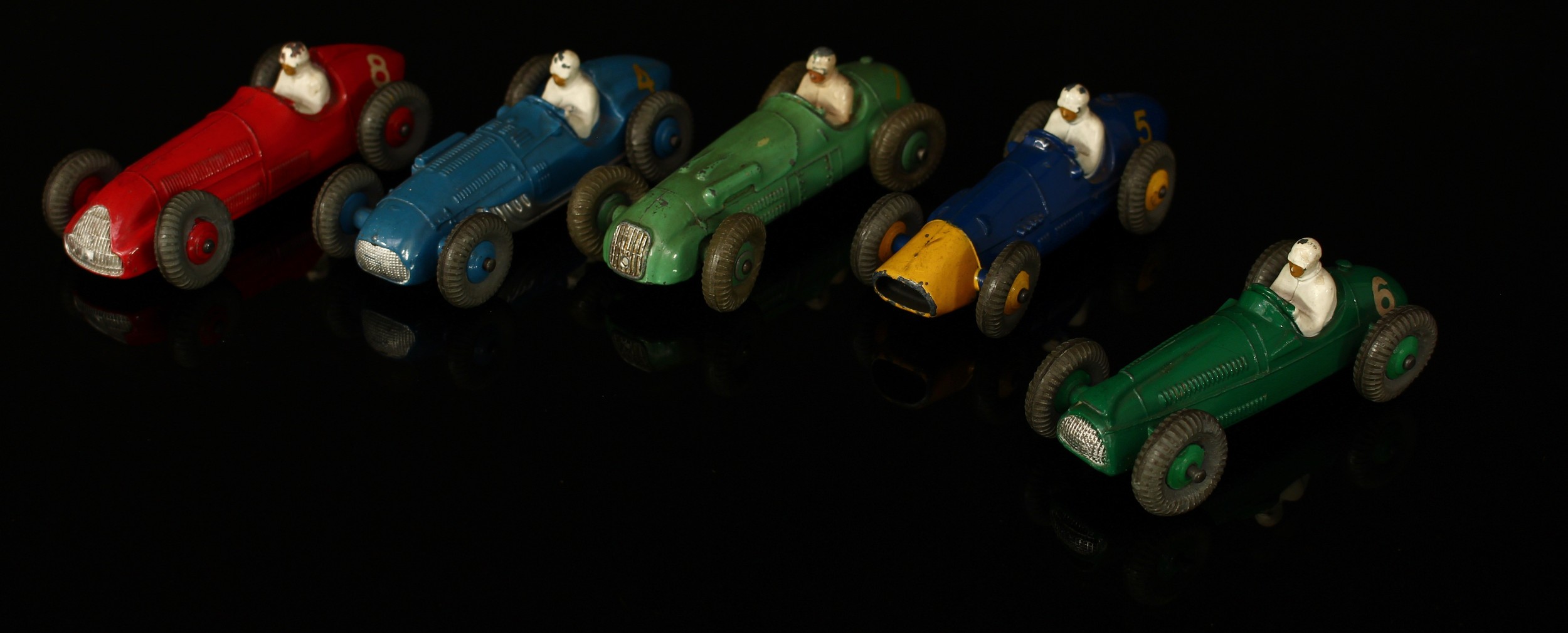 A collection of unboxed Dinky Toys, comprising 23J H.W.M racing car, light green body with racing