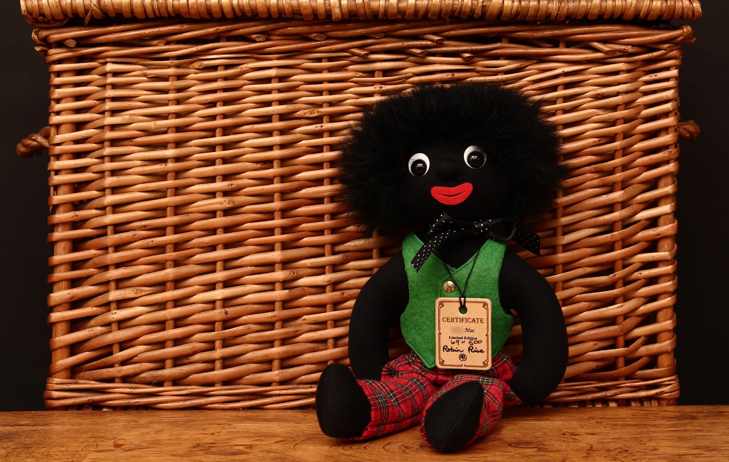 Robin Rive Countrylife (New Zealand) Mac doll, wearing a green waistcoat with red Tartan patterned