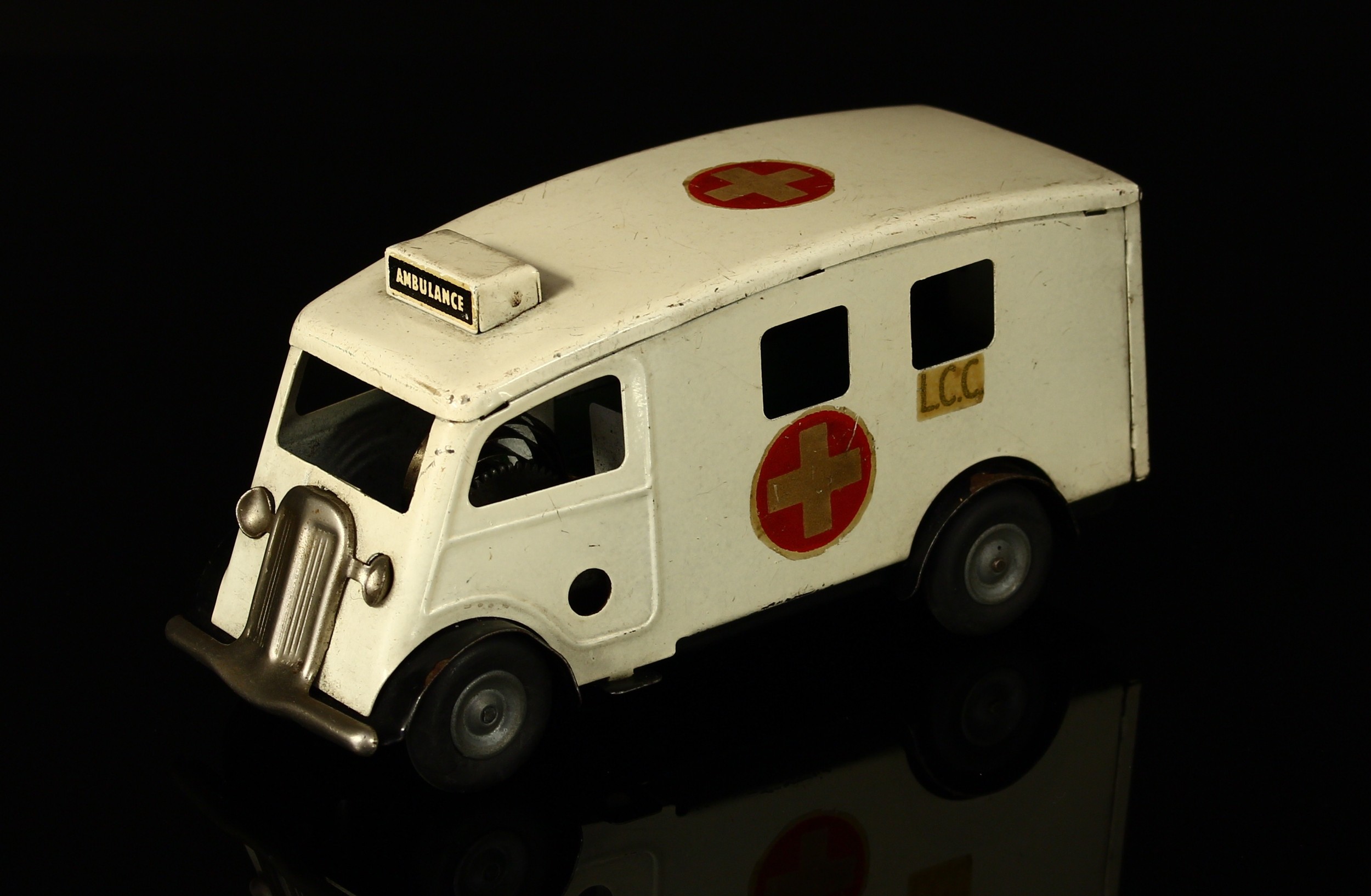 Tri-ang Minic (Lines Brothers) tinplate and clockwork 75M ambulance, off-white body with black wheel