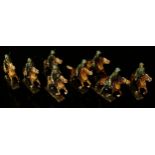 A collection of Lineol (Germany) painted composition figures, each mounted on horseback,