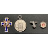 WW2 Third Reich Awards and insignia collection to include: Ehrenkreuz der Deutsche Mutter Dritte