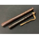 A hardwood truncheon by Hiatt and Co, Birmingham 38cm in length and another Military Police example,