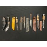 Six stag handled hunting knives and a small kukri knife. (6)