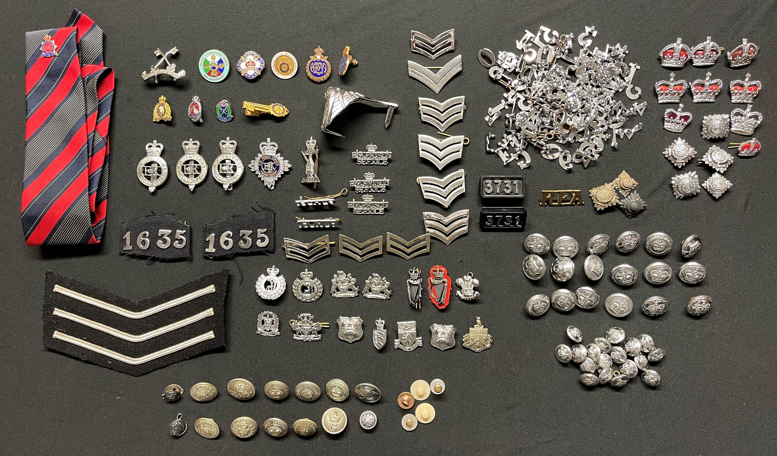 A collection of British Police insignia, buttons, numerals, enamel badges etc to include: a