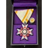 Japanese Order of Sacred Treasure 6th Class complete with ribbon and ribbon devise in black