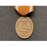 WW2 Third Reich Deutsches Schutzwall-Ehrenzeichen - West Wall Medal. Early issue example in Tombak